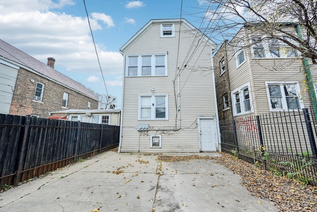 back of house with a patio