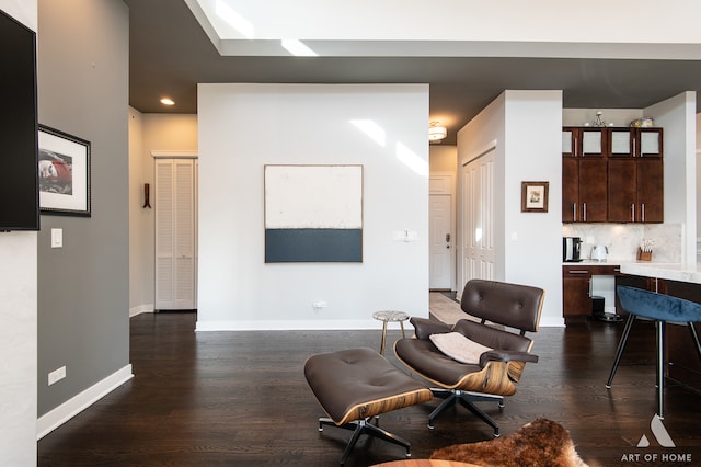 living room with dark hardwood / wood-style floors