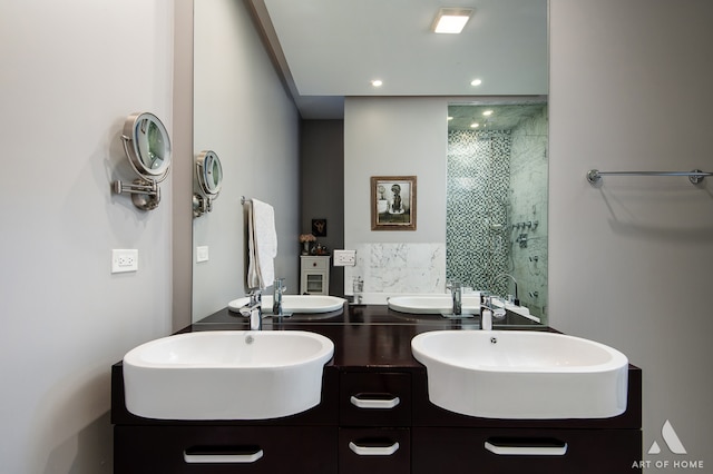 bathroom featuring vanity and an enclosed shower