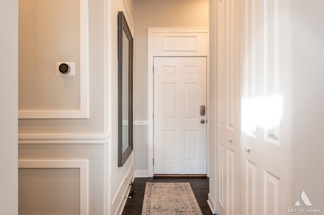 doorway with dark hardwood / wood-style floors