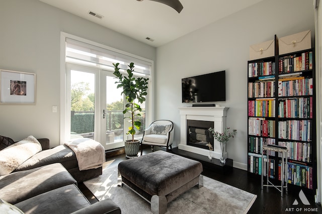 living room with dark hardwood / wood-style flooring