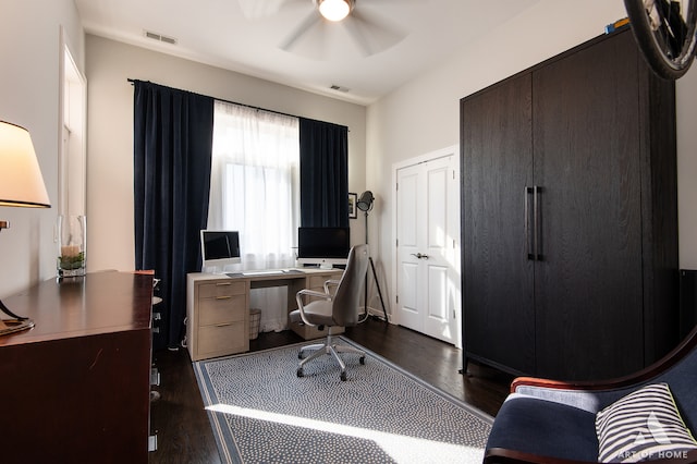 office space with dark hardwood / wood-style floors and ceiling fan