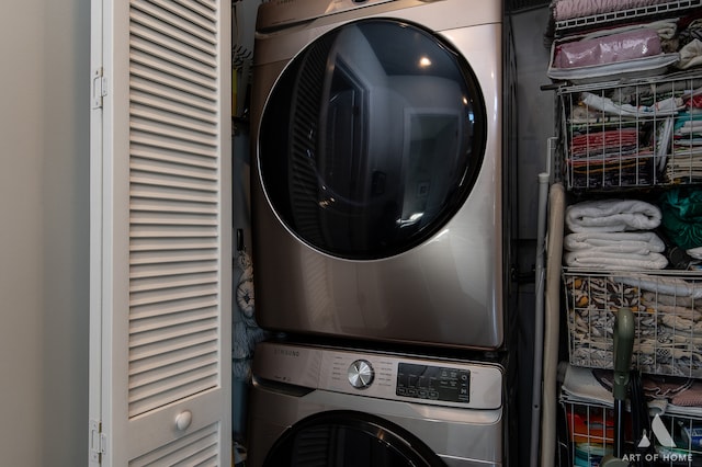 washroom with stacked washer and dryer