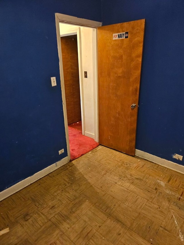 unfurnished room with parquet floors