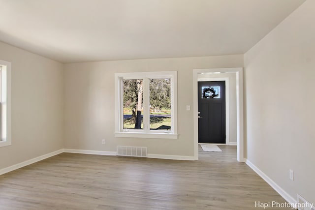 foyer with light hardwood / wood-style floors