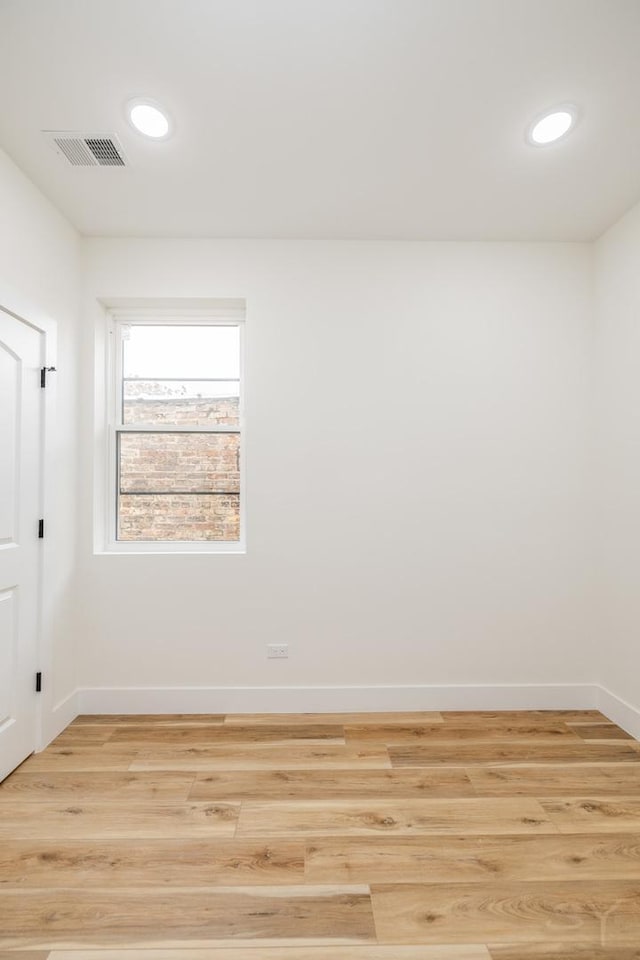 unfurnished room featuring light wood-type flooring