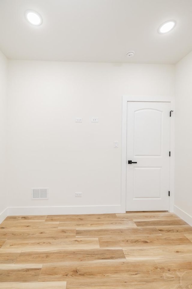 empty room with light wood-type flooring