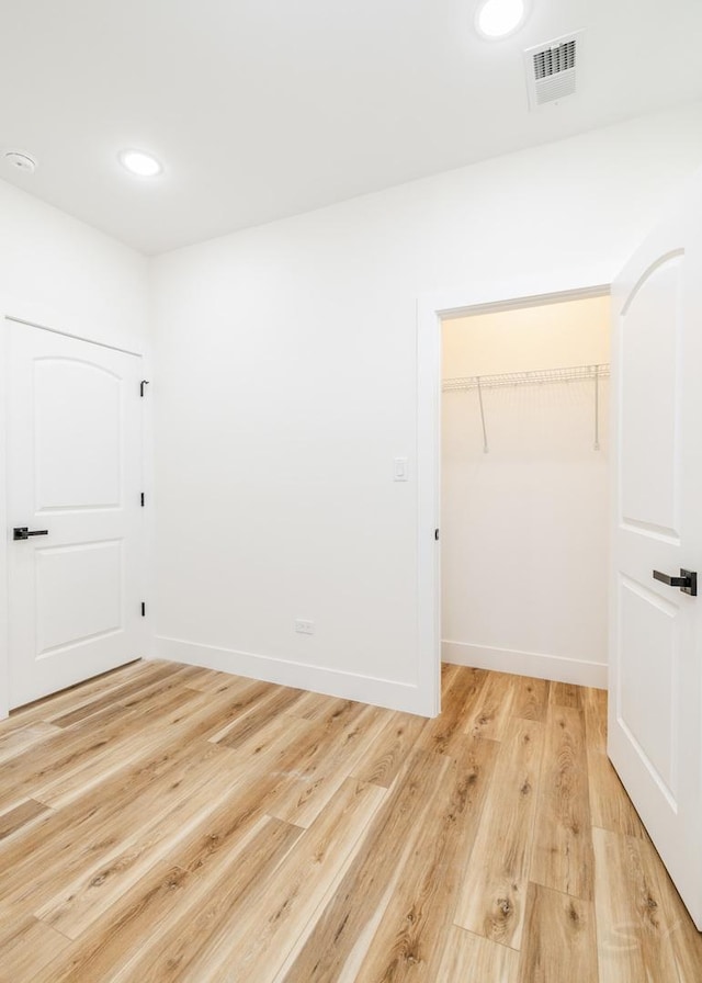 empty room featuring light hardwood / wood-style floors