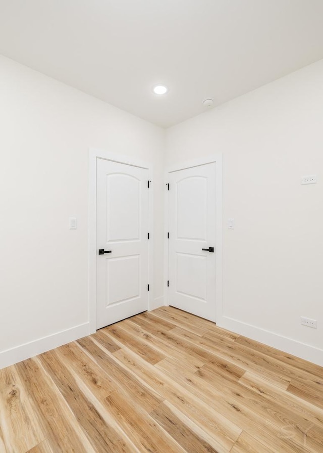 unfurnished room featuring hardwood / wood-style floors