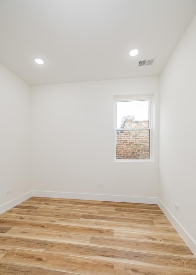 unfurnished room featuring light hardwood / wood-style flooring