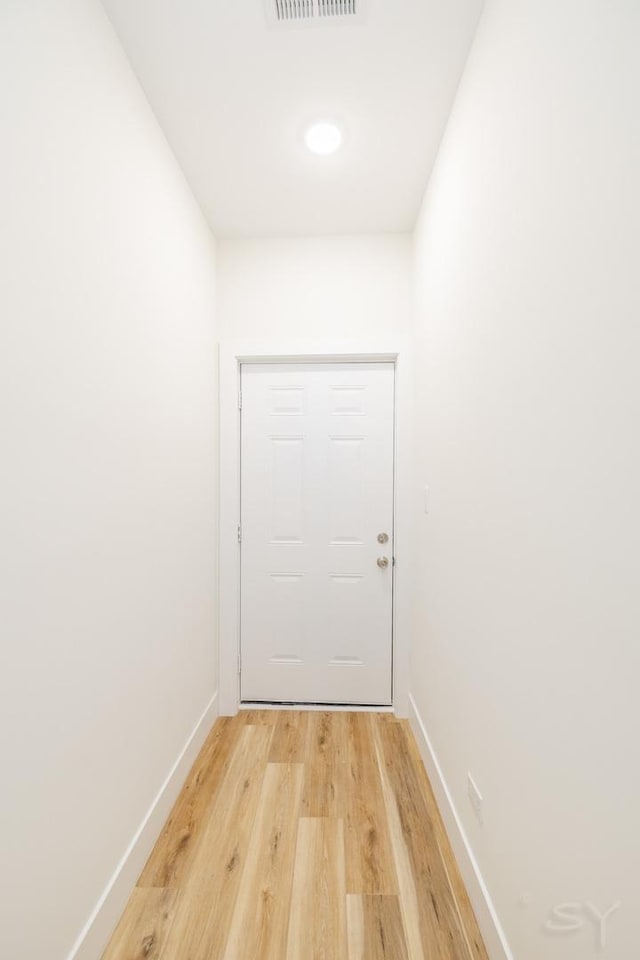 doorway to outside featuring light hardwood / wood-style floors