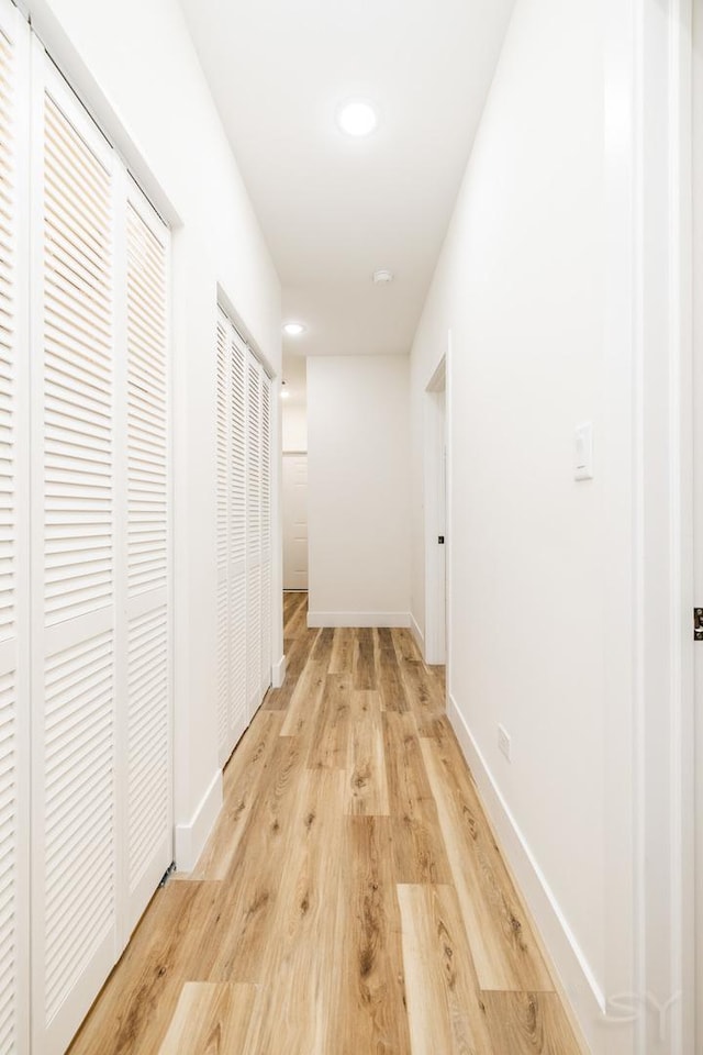 corridor featuring light wood-type flooring