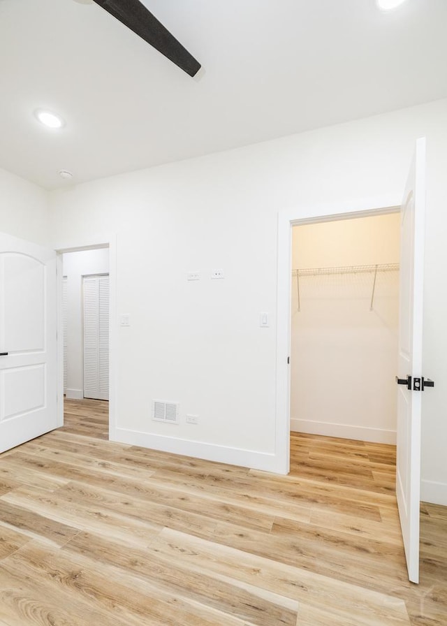 spare room featuring light hardwood / wood-style floors