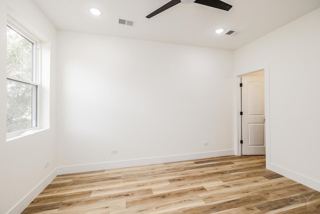 spare room featuring ceiling fan and light wood-type flooring