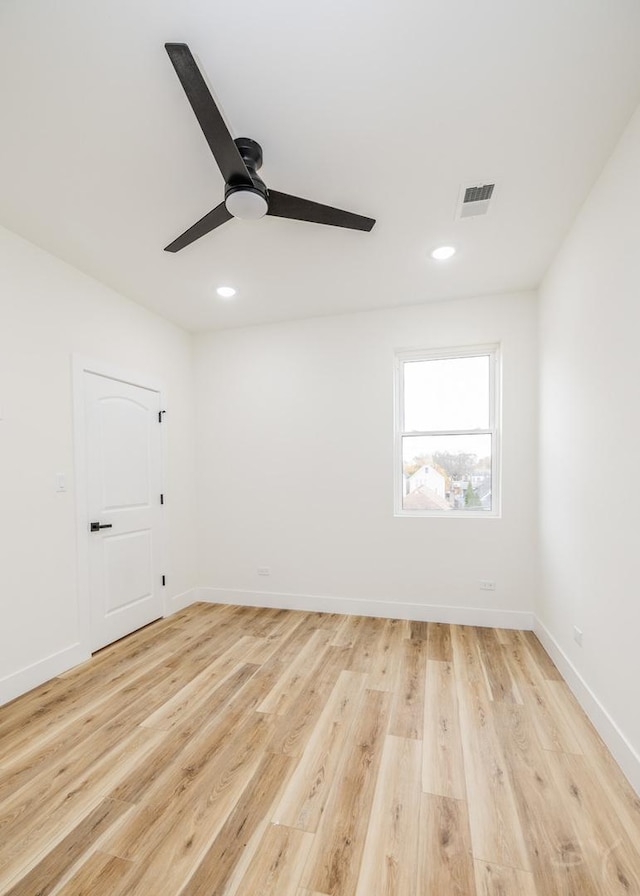 unfurnished room featuring light hardwood / wood-style flooring and ceiling fan