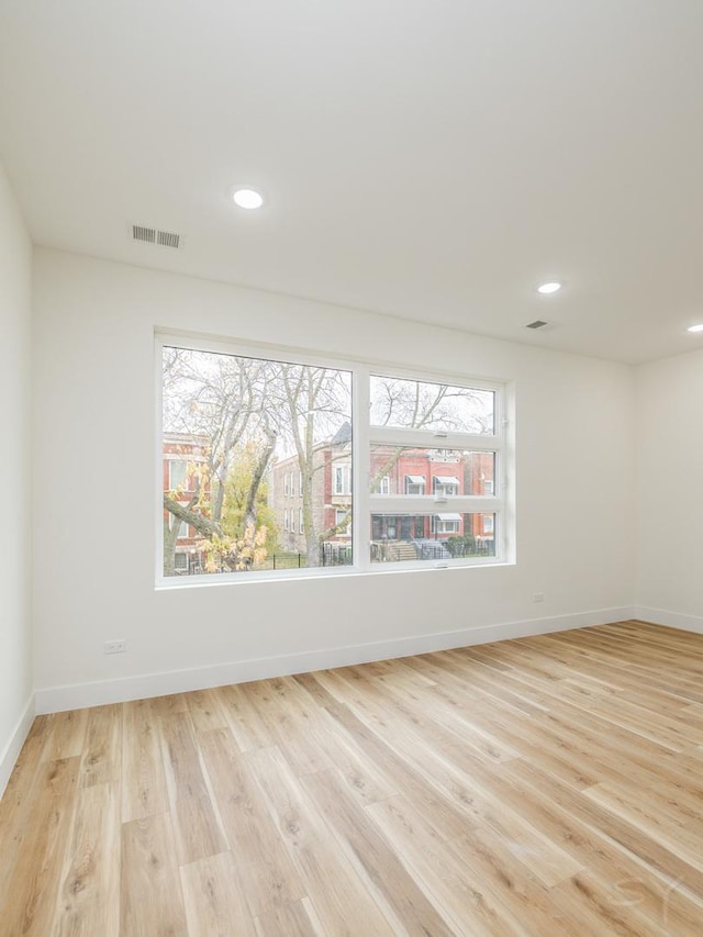 spare room with light wood-type flooring