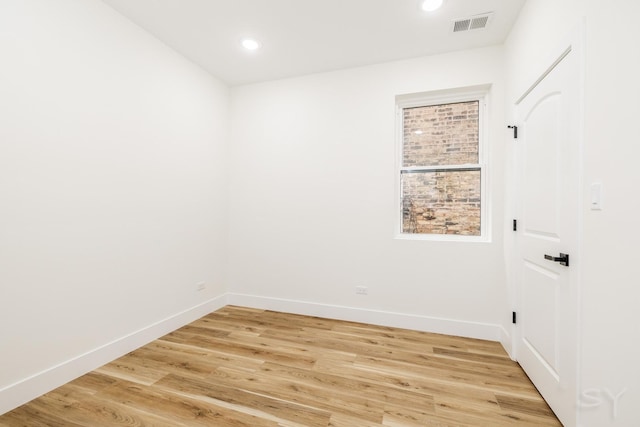 empty room with light wood-type flooring