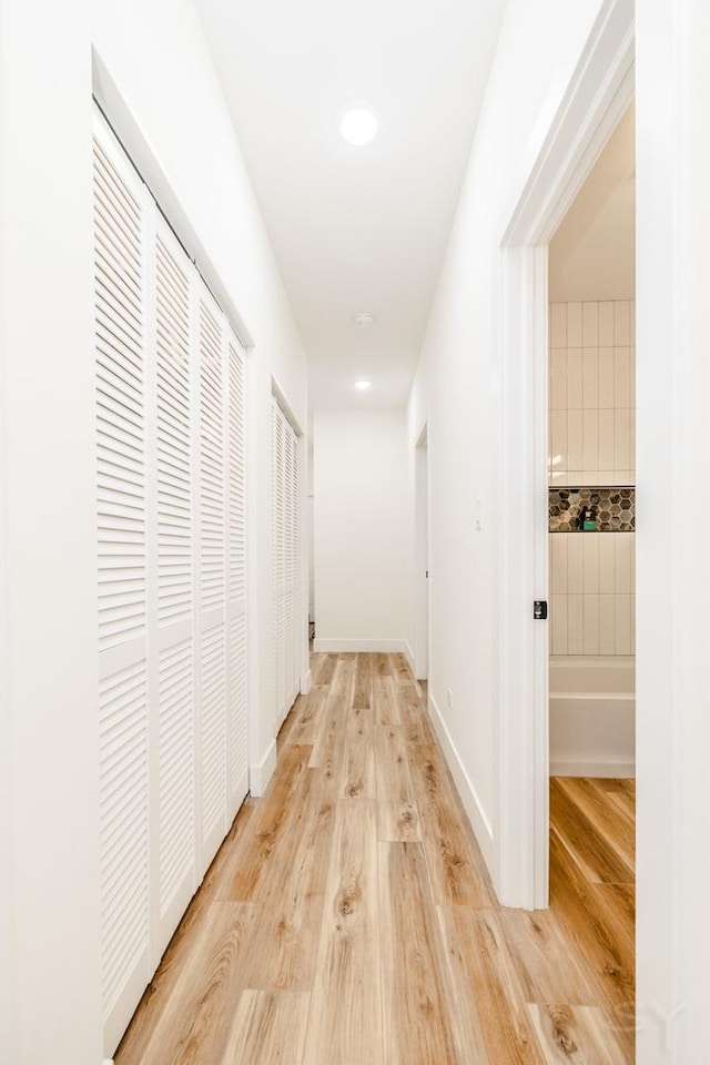 corridor featuring light hardwood / wood-style floors