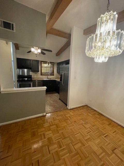 kitchen featuring light parquet floors, ceiling fan with notable chandelier, sink, kitchen peninsula, and stainless steel appliances