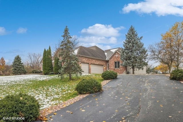 view of side of home with a garage