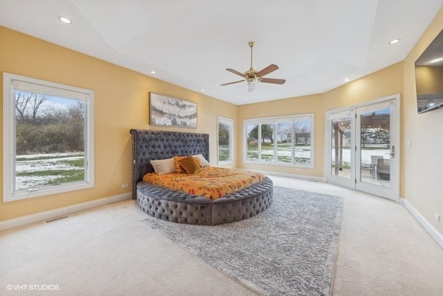 bedroom with ceiling fan, access to exterior, and light colored carpet