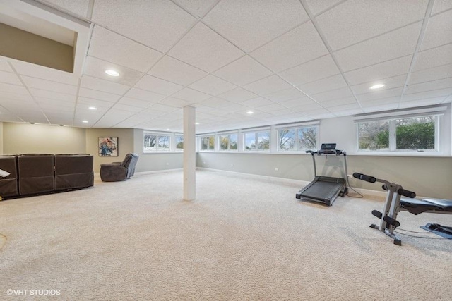 workout area featuring a paneled ceiling and carpet floors