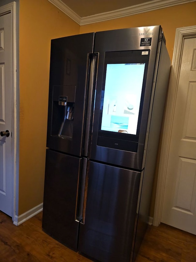 kitchen with stainless steel appliances, crown molding, and sink