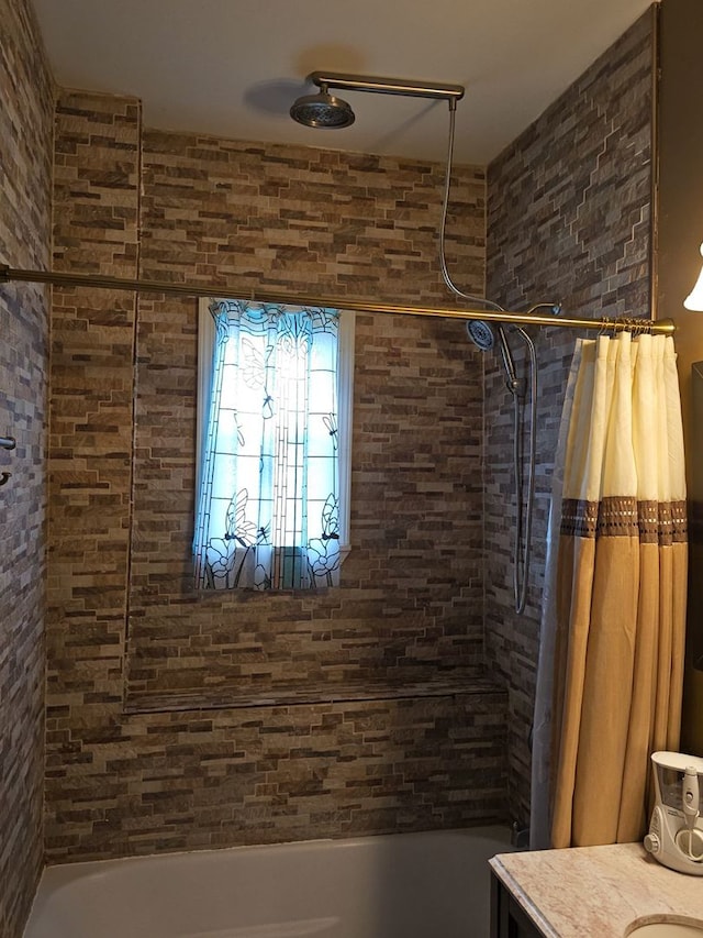 bathroom with vanity and shower / bath combo