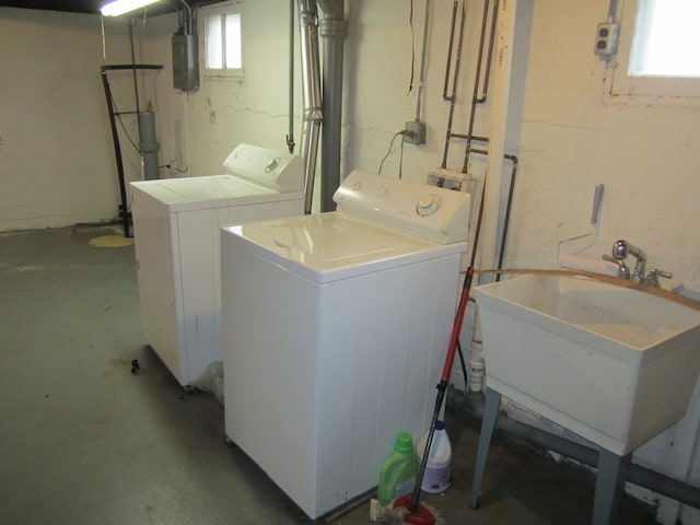 laundry room with washer and clothes dryer and sink