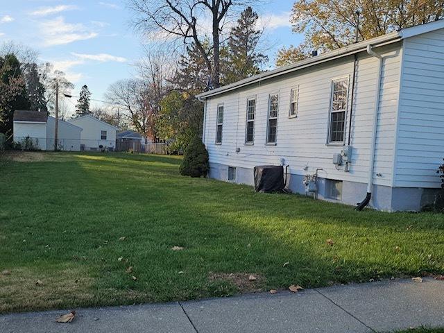 view of property exterior featuring a yard