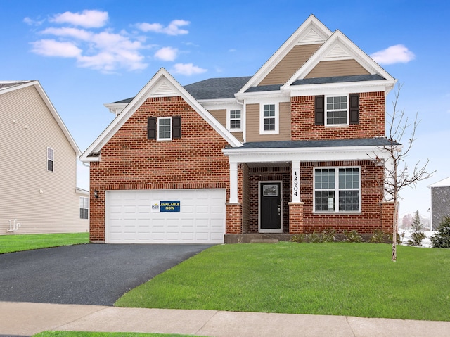 view of front of home featuring a garage and a front lawn