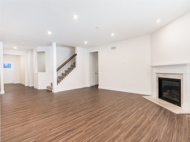 unfurnished living room with dark hardwood / wood-style floors