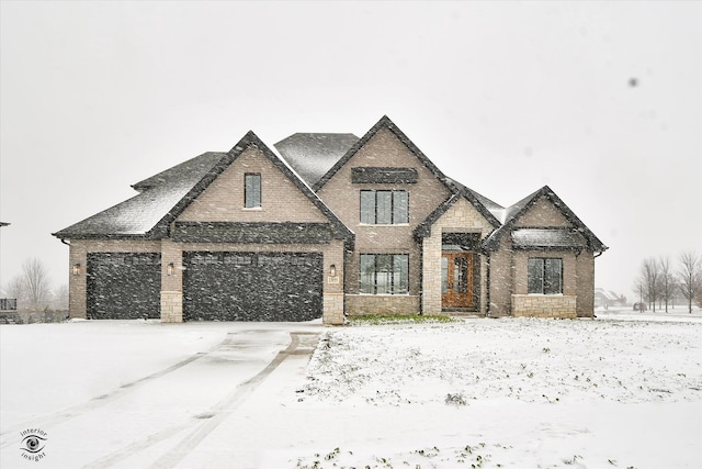 french country inspired facade featuring a garage