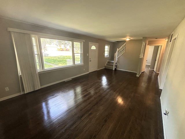 interior space with dark hardwood / wood-style flooring