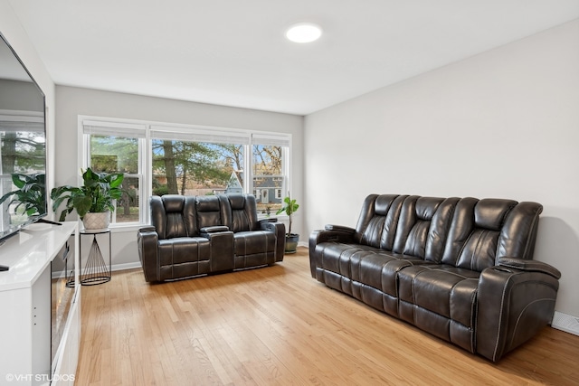 living room with light hardwood / wood-style flooring