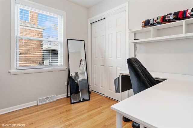 home office featuring hardwood / wood-style floors