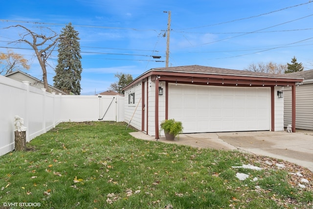 garage featuring a lawn