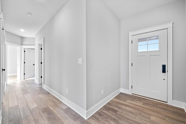 kitchen with dark hardwood / wood-style flooring, white cabinetry, sink, and appliances with stainless steel finishes