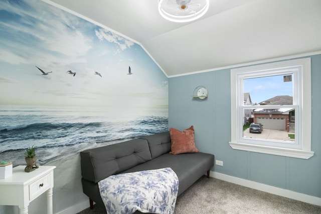 sitting room featuring carpet and lofted ceiling