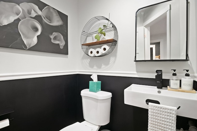 bathroom with toilet and sink