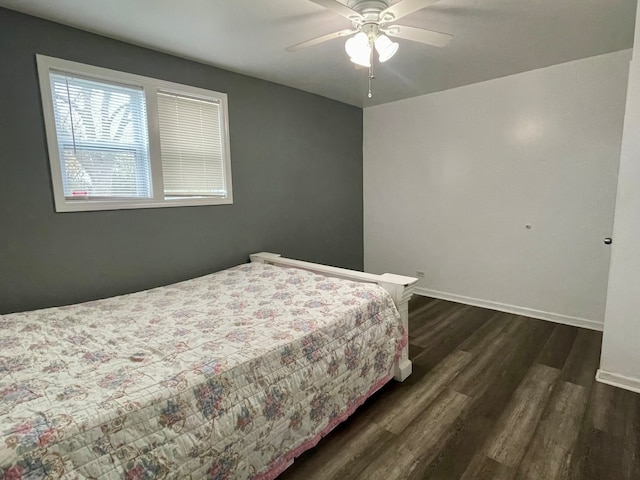 bedroom featuring ceiling fan and dark hardwood / wood-style flooring