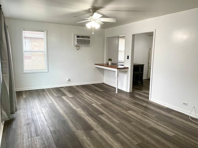 unfurnished living room featuring a wall mounted AC, ceiling fan, and dark hardwood / wood-style floors