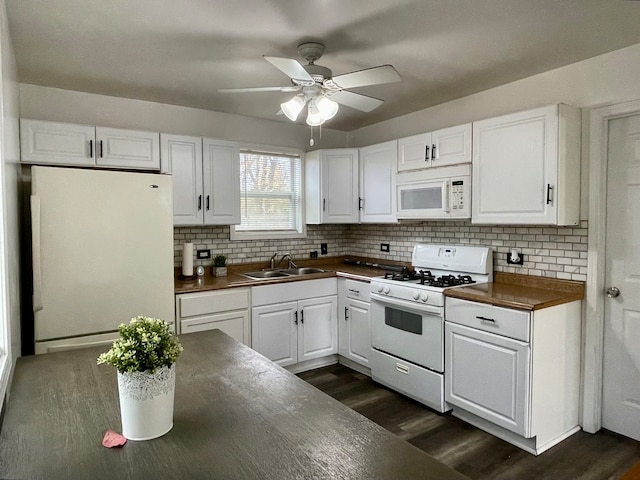 kitchen featuring white cabinetry, sink, dark hardwood / wood-style floors, backsplash, and white appliances