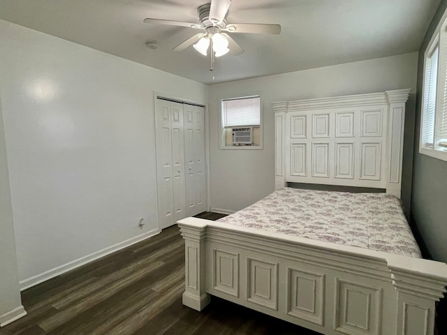 bedroom featuring ceiling fan, a closet, dark hardwood / wood-style flooring, and multiple windows