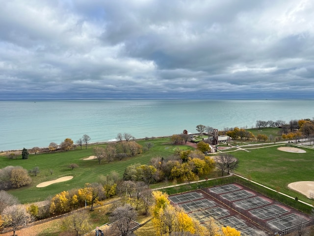 view of property's community featuring a water view and a yard