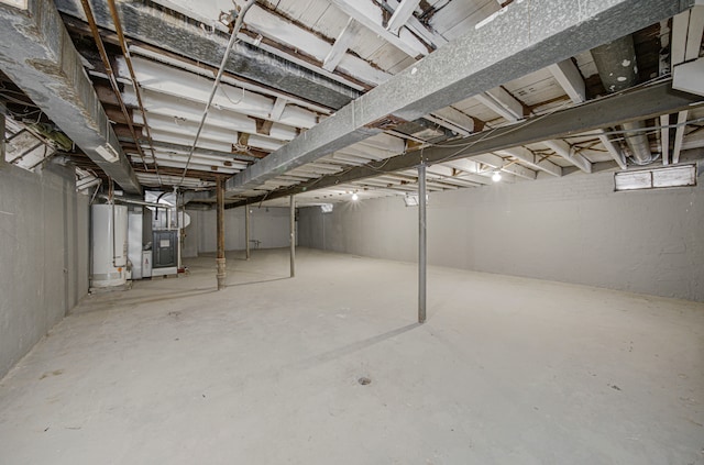 basement with gas water heater and heating unit