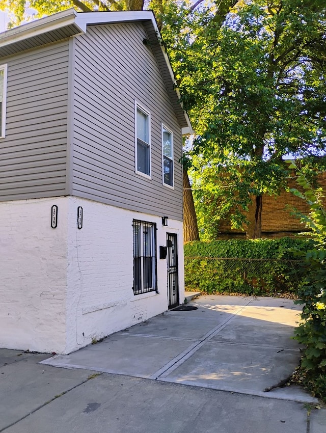 view of side of home featuring a patio area