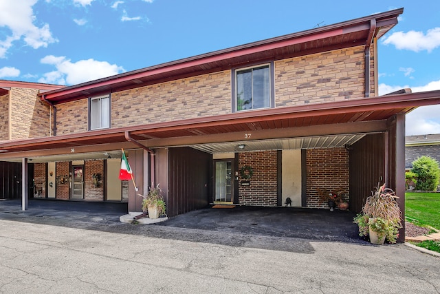 view of front facade with a carport