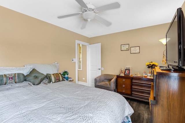 bedroom featuring ceiling fan and dark wood-type flooring