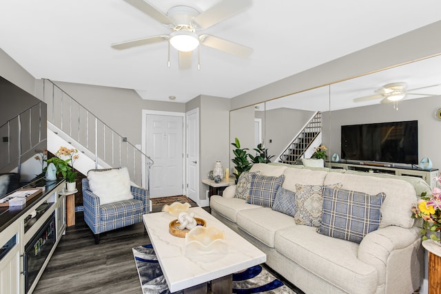 living room with ceiling fan and dark hardwood / wood-style floors